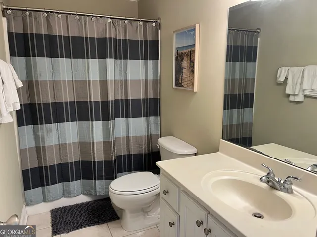 a bedroom with two beds and a window