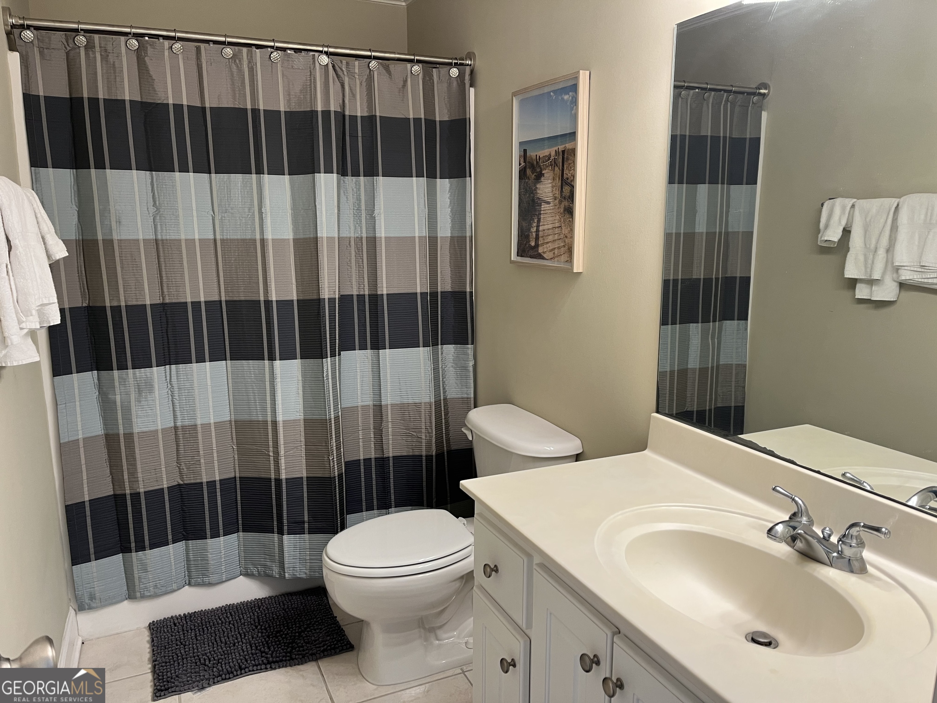372 Moss Oak Circle St. Simons, GA 31522 - Photo 25 of 44 a bathroom with a sink a toilet and shower