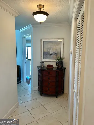 a living room with a mirror and a table