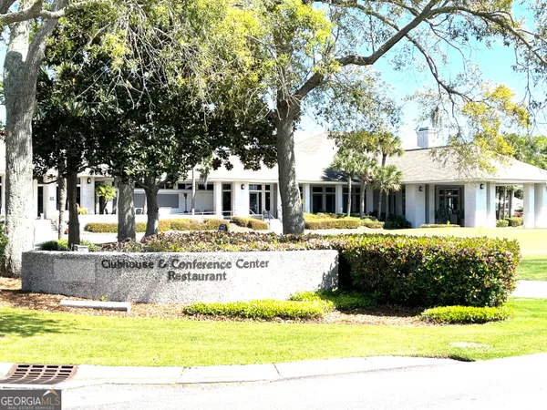 a view of a swimming pool with a yard