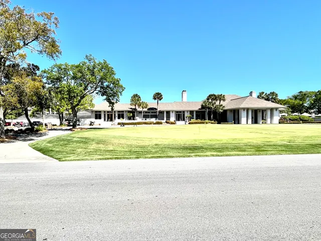 a view of a swimming pool and a yard