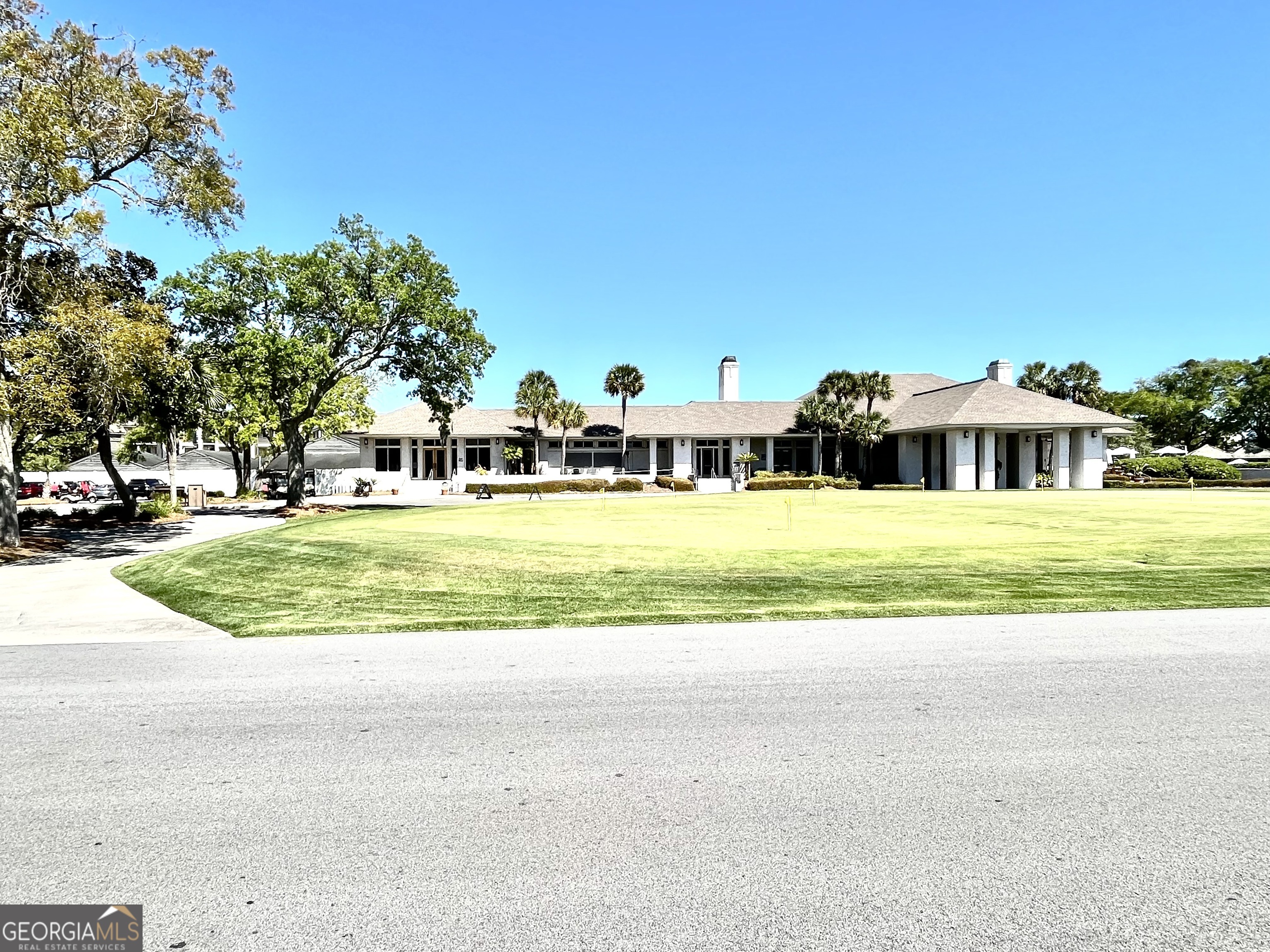 372 Moss Oak Circle St. Simons, GA 31522 - Photo 33 of 44 a view of a swimming pool with a yard