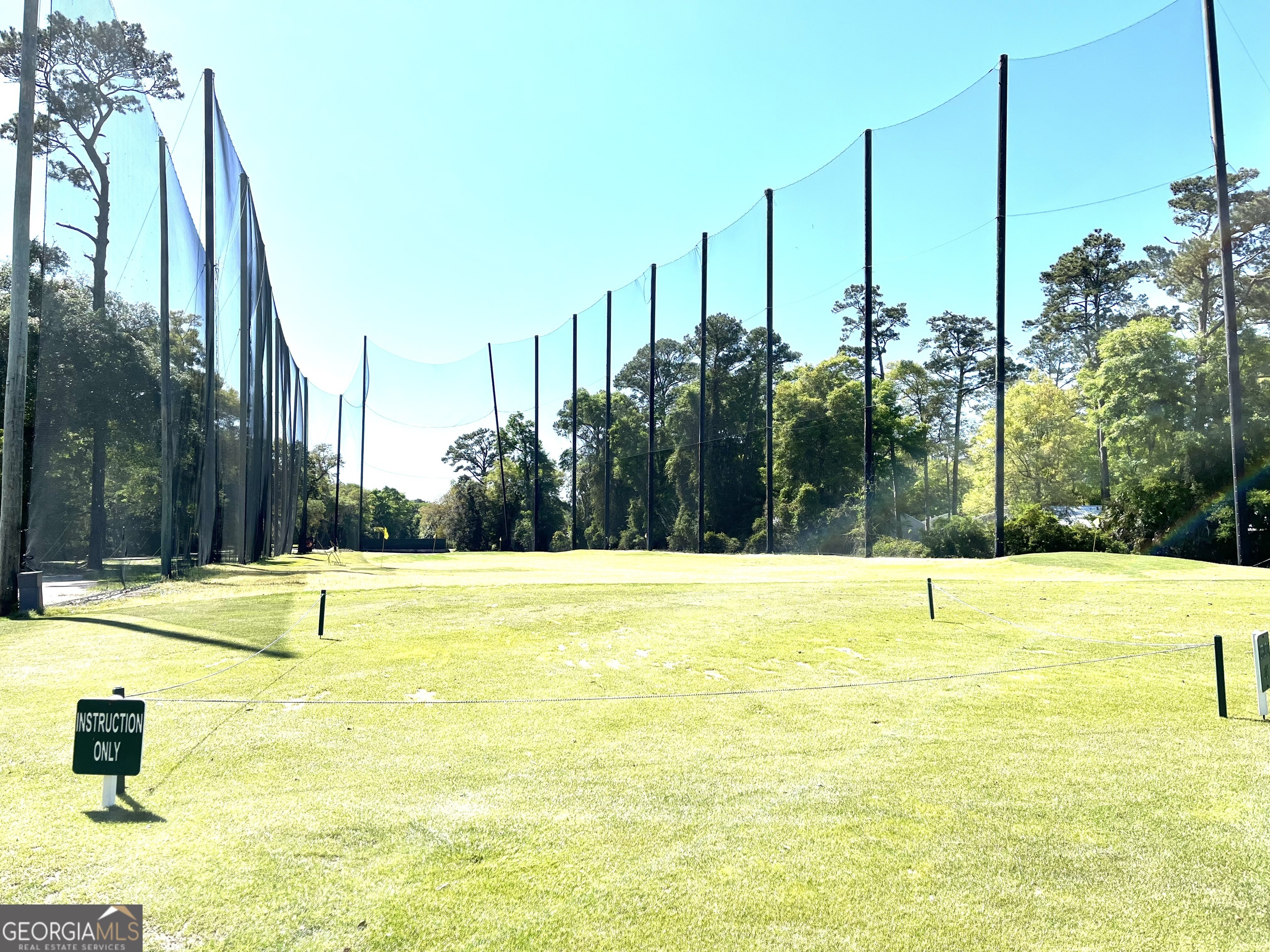 372 Moss Oak Circle St. Simons, GA 31522 - Photo 37 of 44 a view of a swimming pool with a yard