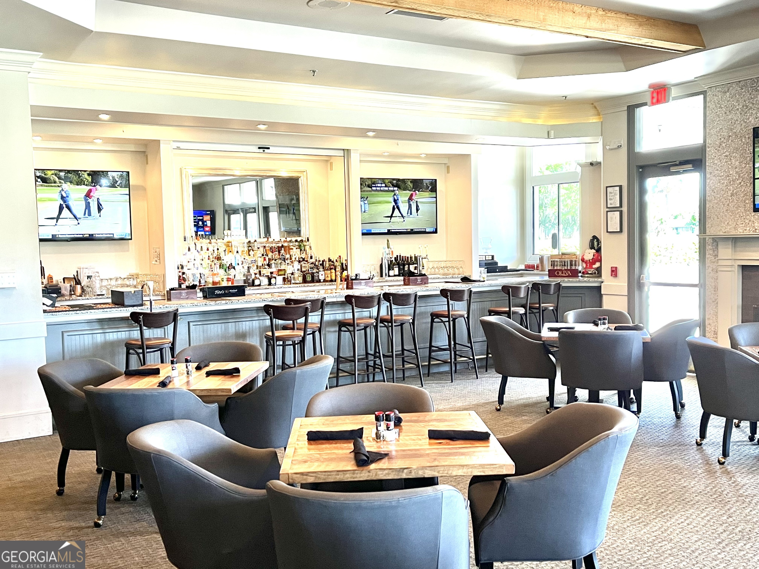 372 Moss Oak Circle St. Simons, GA 31522 - Photo 44 of 44 a living room with couches a coffee table and kitchen view with wooden floor