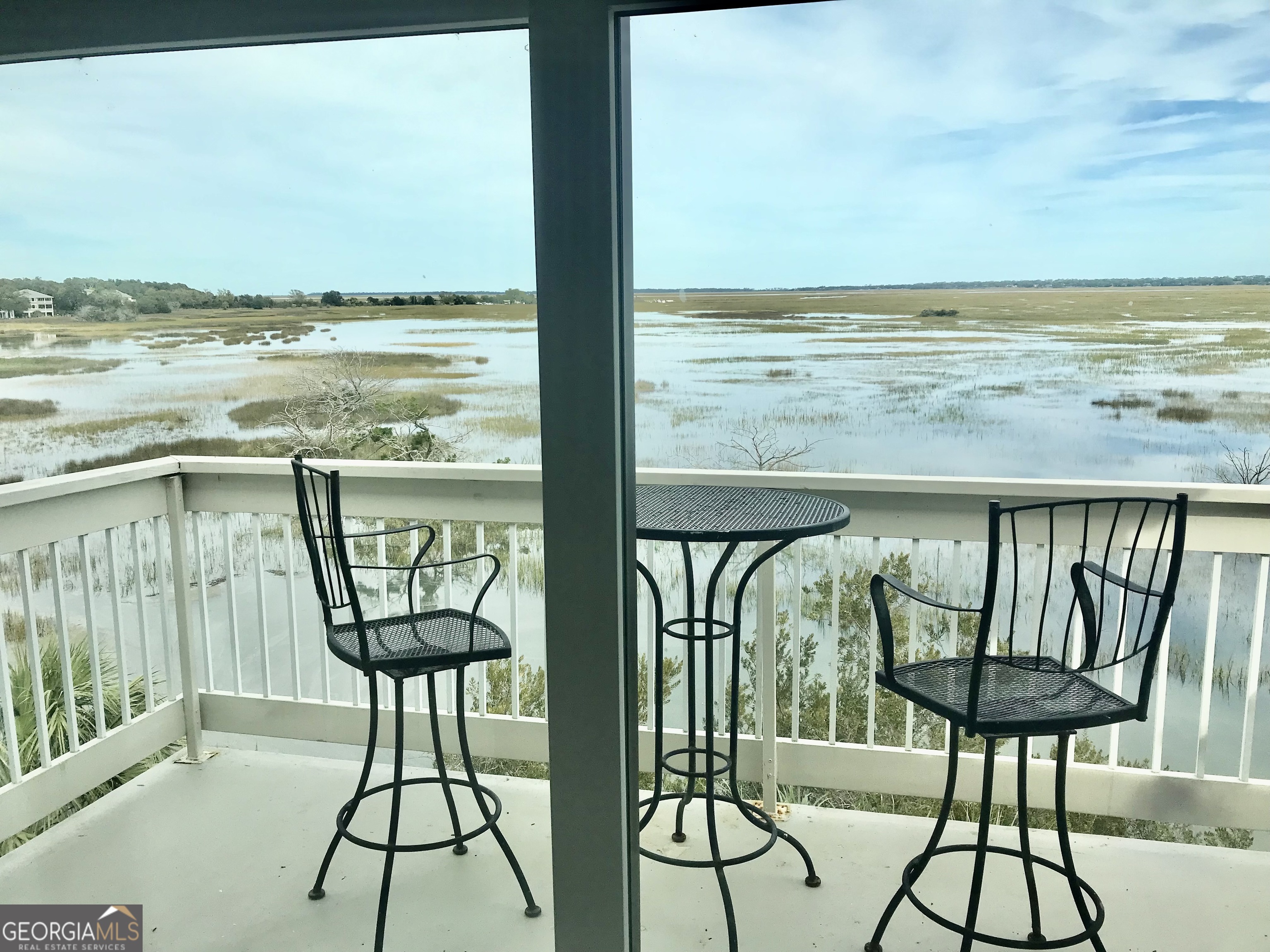 372 Moss Oak Circle St. Simons, GA 31522 - Photo 5 of 44 a view of ocean from balcony with furniture