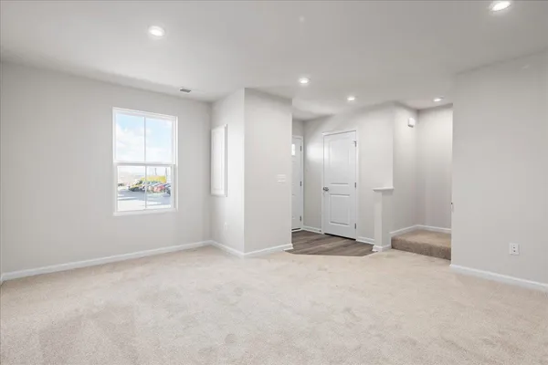 a kitchen with a sink refrigerator and cabinets