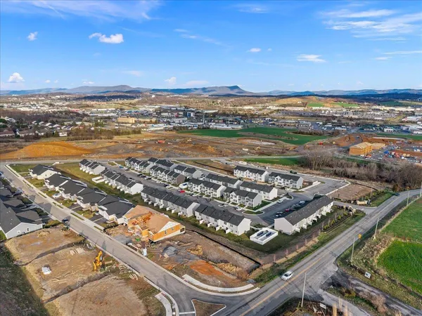 an aerial view of residential building and ocean view