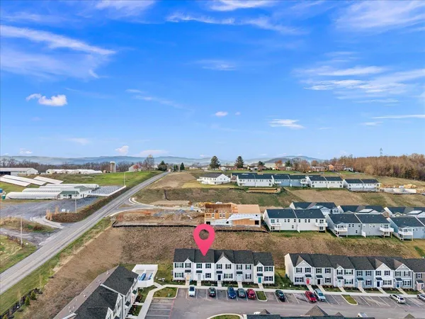 an aerial view of residential building with outdoor space ocean view