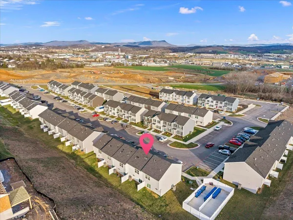 an aerial view of residential houses with outdoor space