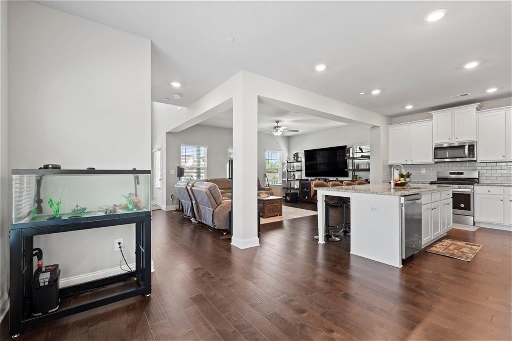 1030 Shy Lane Marietta, GA 30060 - Photo 19 of 50 a view of kitchen with cabinets and flat screen tv