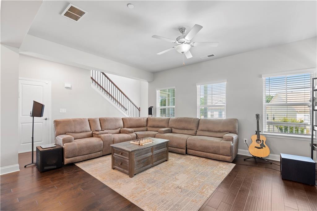 1030 Shy Lane Marietta, GA 30060 - Photo 20 of 50 a living room with furniture and wooden floor