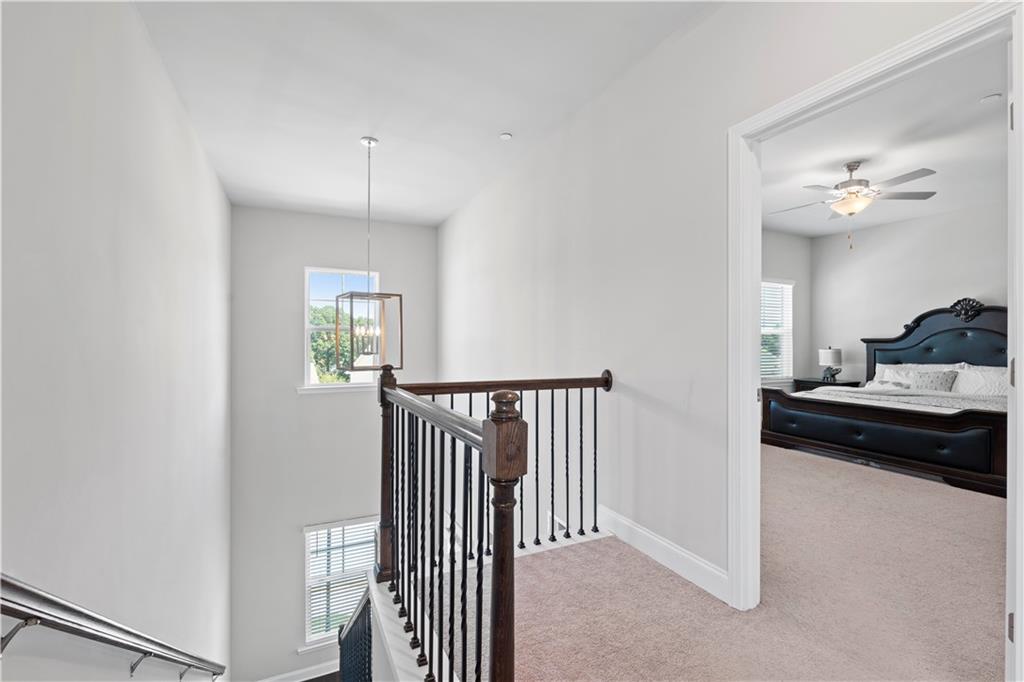 1030 Shy Lane Marietta, GA 30060 - Photo 24 of 50 a bedroom with a bed and a chandelier