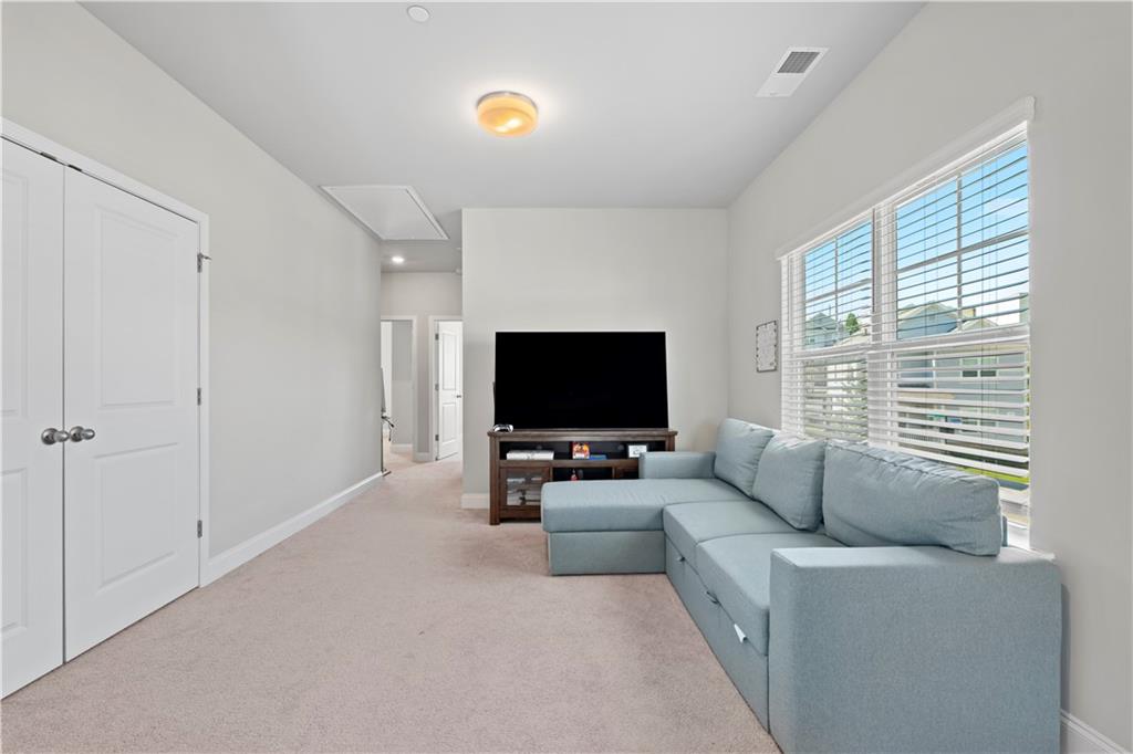 1030 Shy Lane Marietta, GA 30060 - Photo 25 of 50 a living room with furniture and a flat screen tv