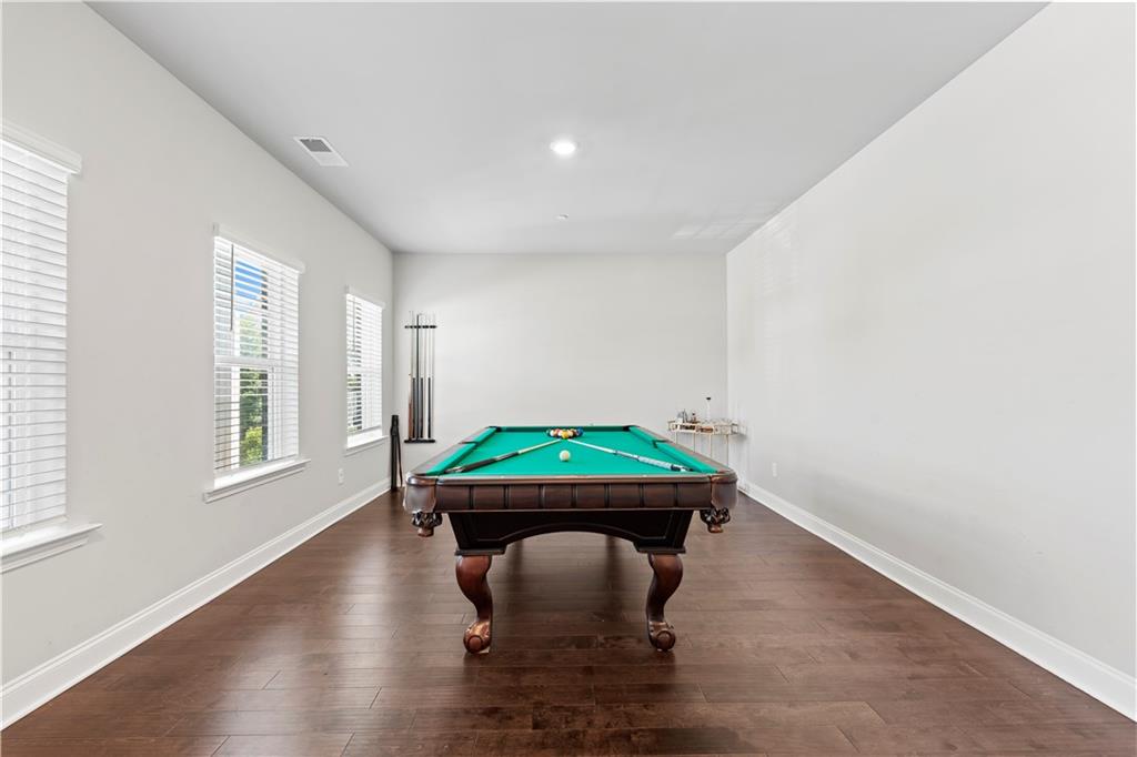 1030 Shy Lane Marietta, GA 30060 - Photo 39 of 50 a room with window and wooden floor