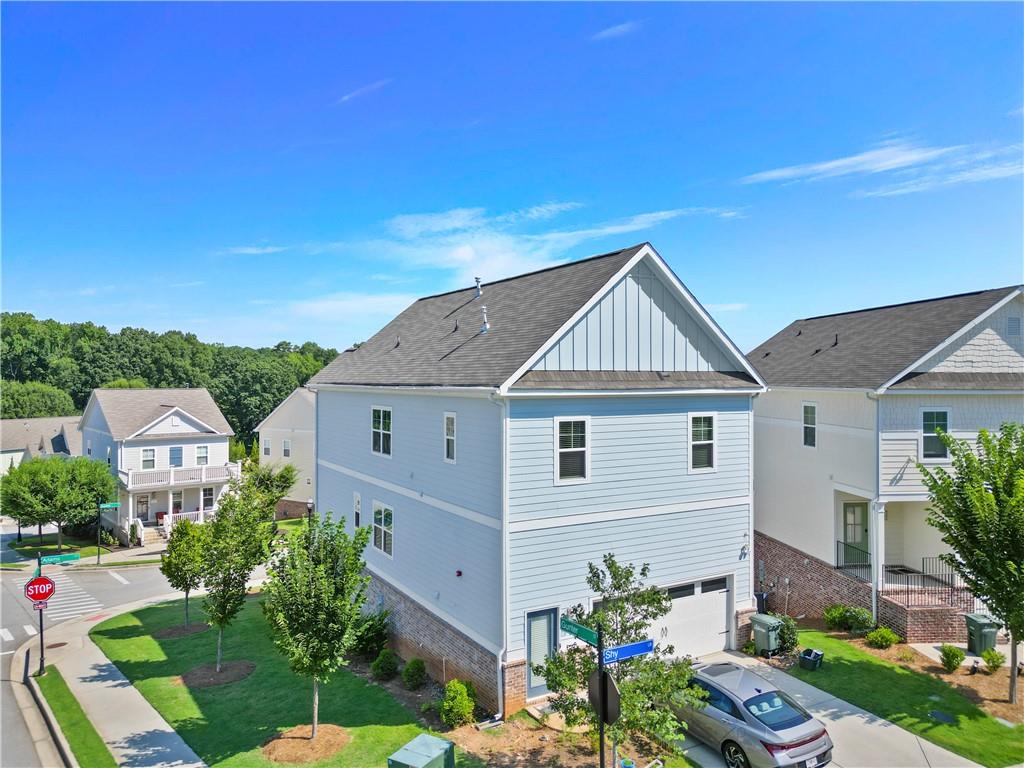 1030 Shy Lane Marietta, GA 30060 - Photo 44 of 50 a view of a house with a yard and potted plants