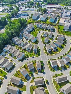 an aerial view of residential houses with outdoor space