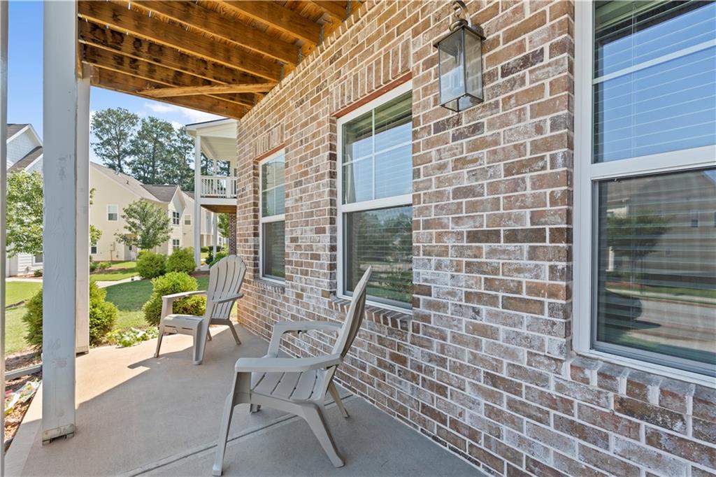 1030 Shy Lane Marietta, GA 30060 - Photo 5 of 50 a view of a chair and table in the balcony