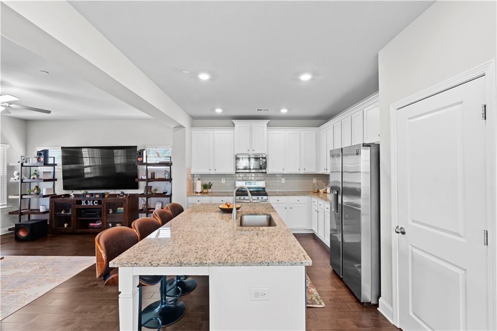 1030 Shy Lane Marietta, GA 30060 - Photo 7 of 50 a large kitchen with a table and chairs in it