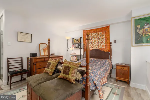 a bed room with a bed and a window