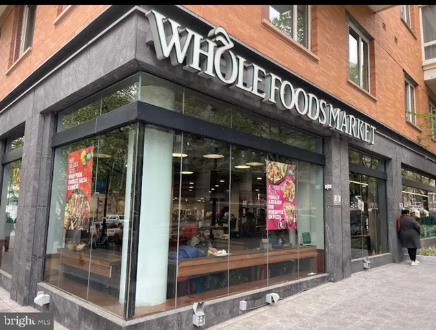 a view of street with shops