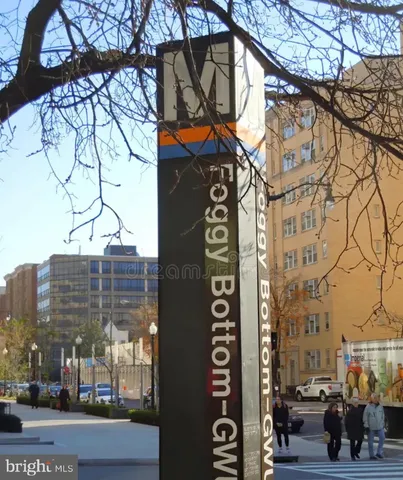 a street sign on a pole on a street