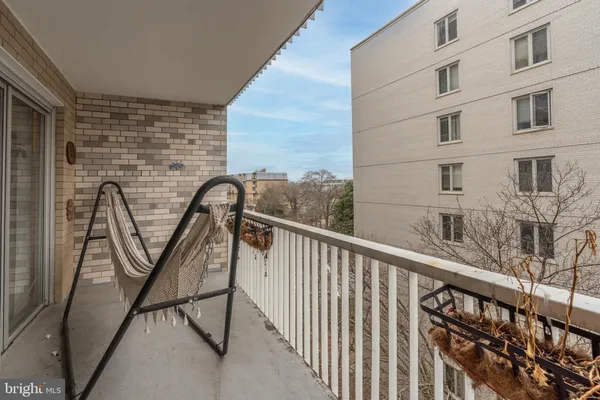 a view of balcony with furniture