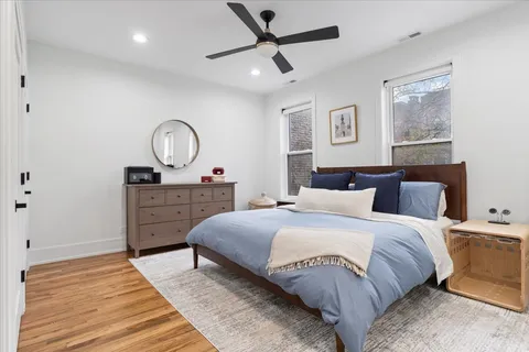 a living room with a bed furniture and a window