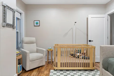 a living room with furniture a couch and a window