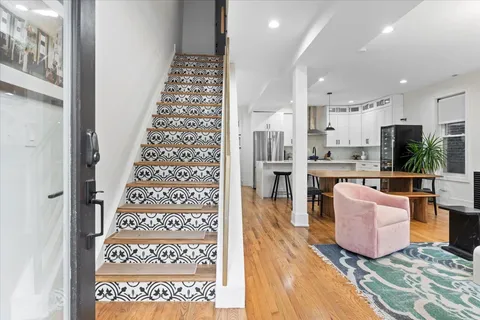 a living room with furniture and a rug
