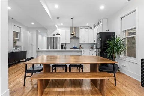 a view living room with furniture and wooden floor