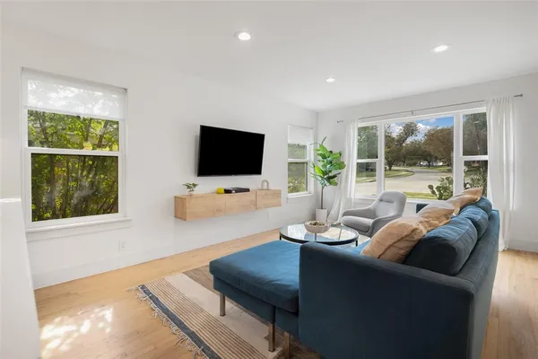 a living room with furniture and a flat screen tv