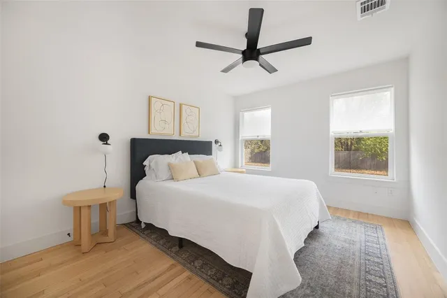 a spacious bedroom with a bed and a window