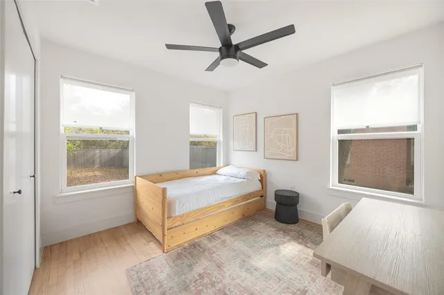 a bedroom with a bed and window