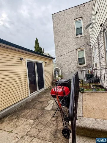 a view of a chairs and table in the patio