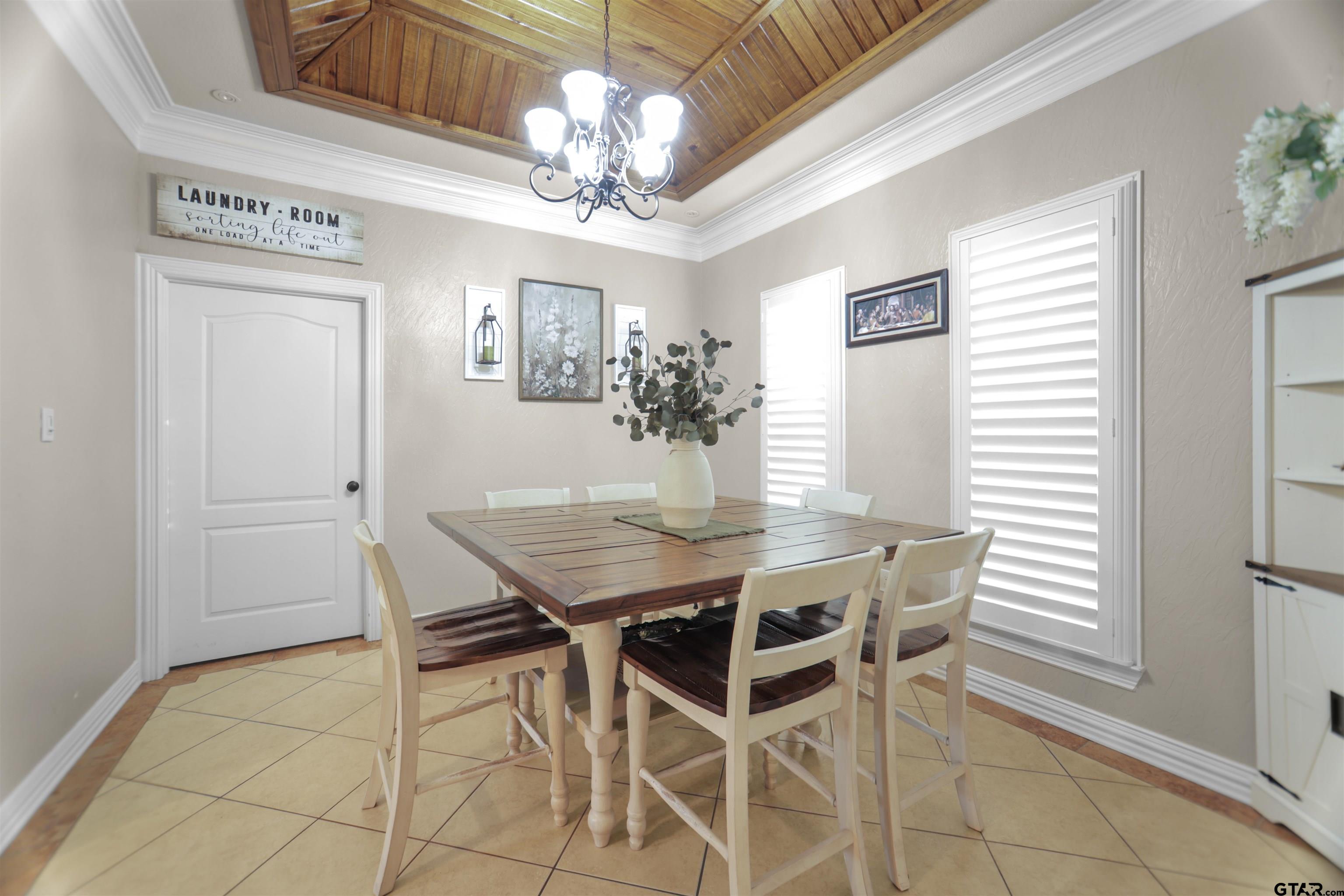 11931 State Highway 64 Tyler, TX 75704 - Photo 26 of 44 a view of a dining room with furniture and chandelier