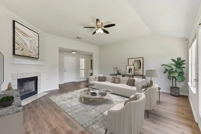 a living room with furniture and a fireplace
