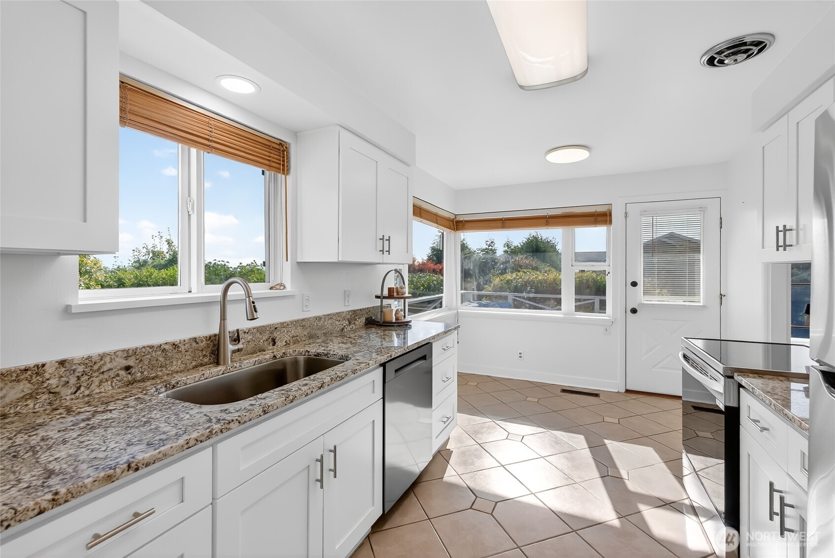 2493 Hilltop Road Ferndale, WA 98248 - Photo 13 of 35 a kitchen with a sink and a stove top oven