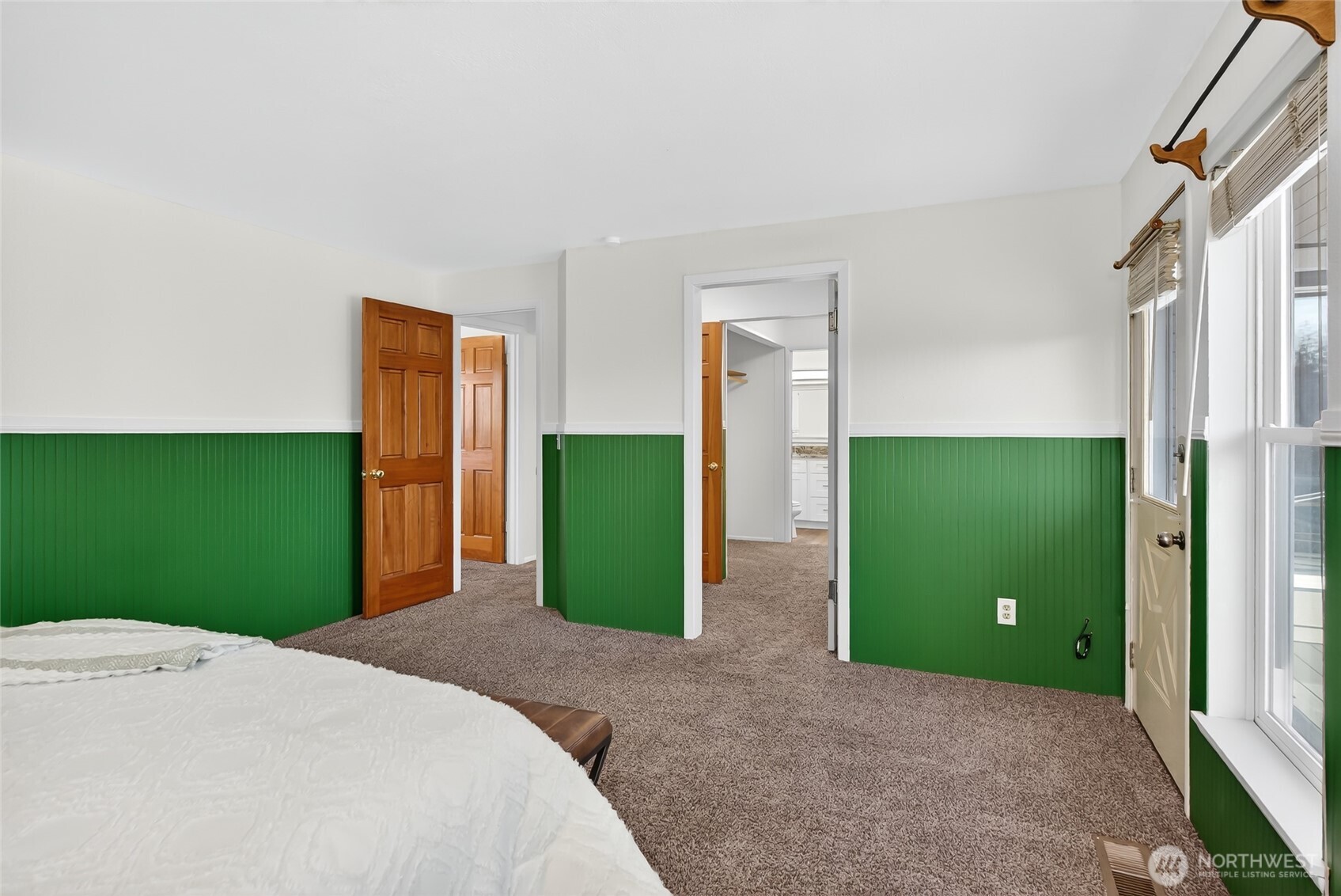 2493 Hilltop Road Ferndale, WA 98248 - Photo 18 of 35 a bedroom with a bed and a mirror