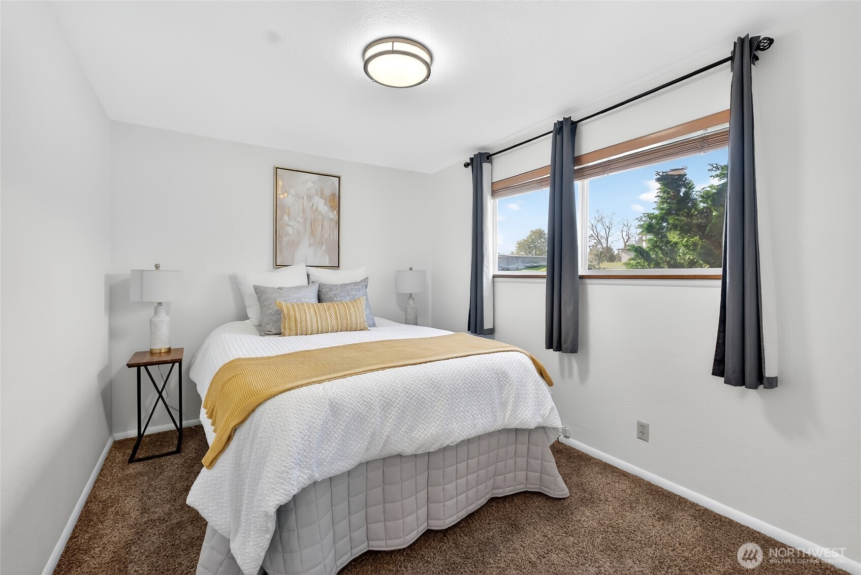 2493 Hilltop Road Ferndale, WA 98248 - Photo 23 of 35 a bedroom with a large bed and a large window