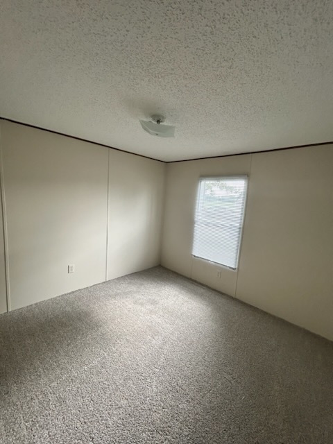 1600 Riverdale Road, Unit 75 Rock Falls, IL 61071 - Photo 12 of 17 an empty room with windows