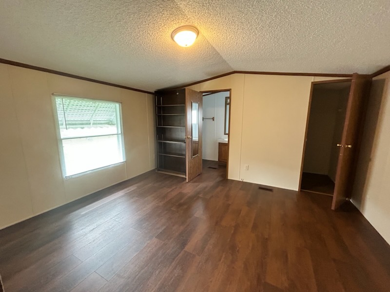 1600 Riverdale Road, Unit 75 Rock Falls, IL 61071 - Photo 15 of 17 an empty room with wooden floor and windows