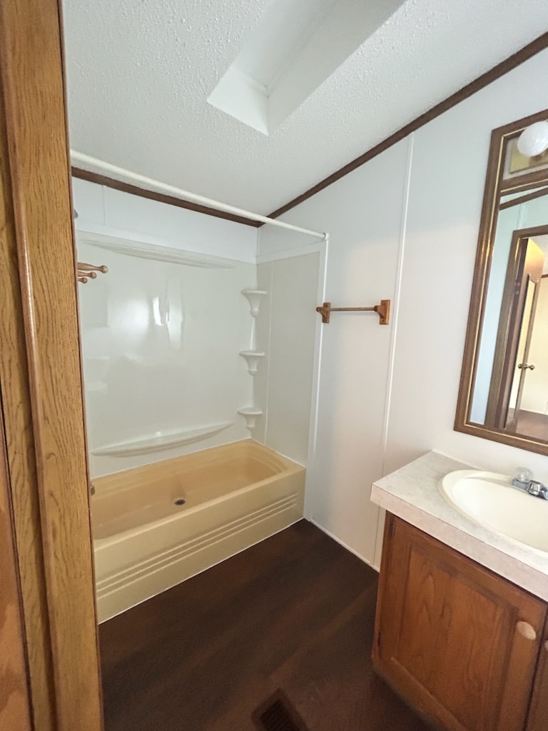 1600 Riverdale Road, Unit 75 Rock Falls, IL 61071 - Photo 17 of 17 a bathroom with a bathtub and a sink
