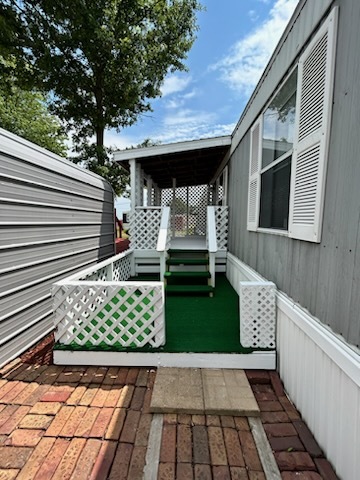1600 Riverdale Road, Unit 75 Rock Falls, IL 61071 - Photo 2 of 17 a front view of a house with garden