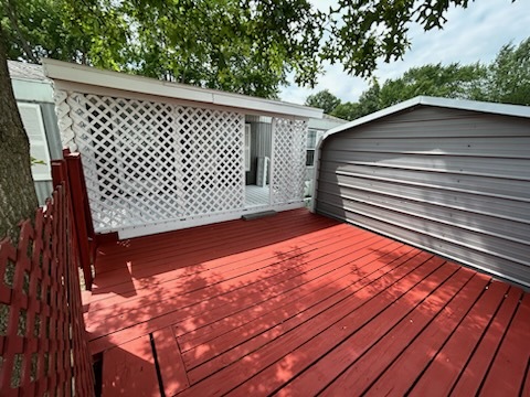 1600 Riverdale Road, Unit 75 Rock Falls, IL 61071 - Photo 5 of 17 a backyard of a house with wooden deck