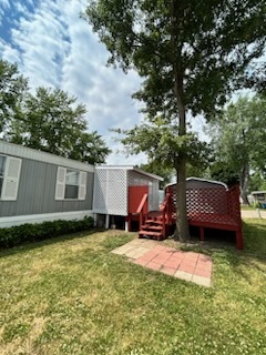 1600 Riverdale Road, Unit 75 Rock Falls, IL 61071 - Photo 6 of 17 a view of a backyard with a sitting area