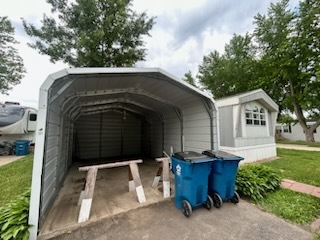 1600 Riverdale Road, Unit 75 Rock Falls, IL 61071 - Photo 7 of 17 a front view of a house with garden
