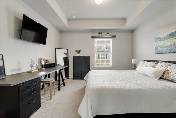 a bedroom with a workspace