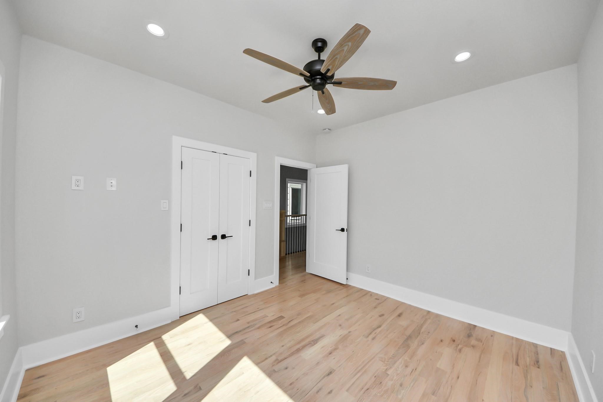 6320 Milwee Street, Unit B Houston, TX 77092 - Photo 14 of 30 a view of a big room with wooden floor and windows