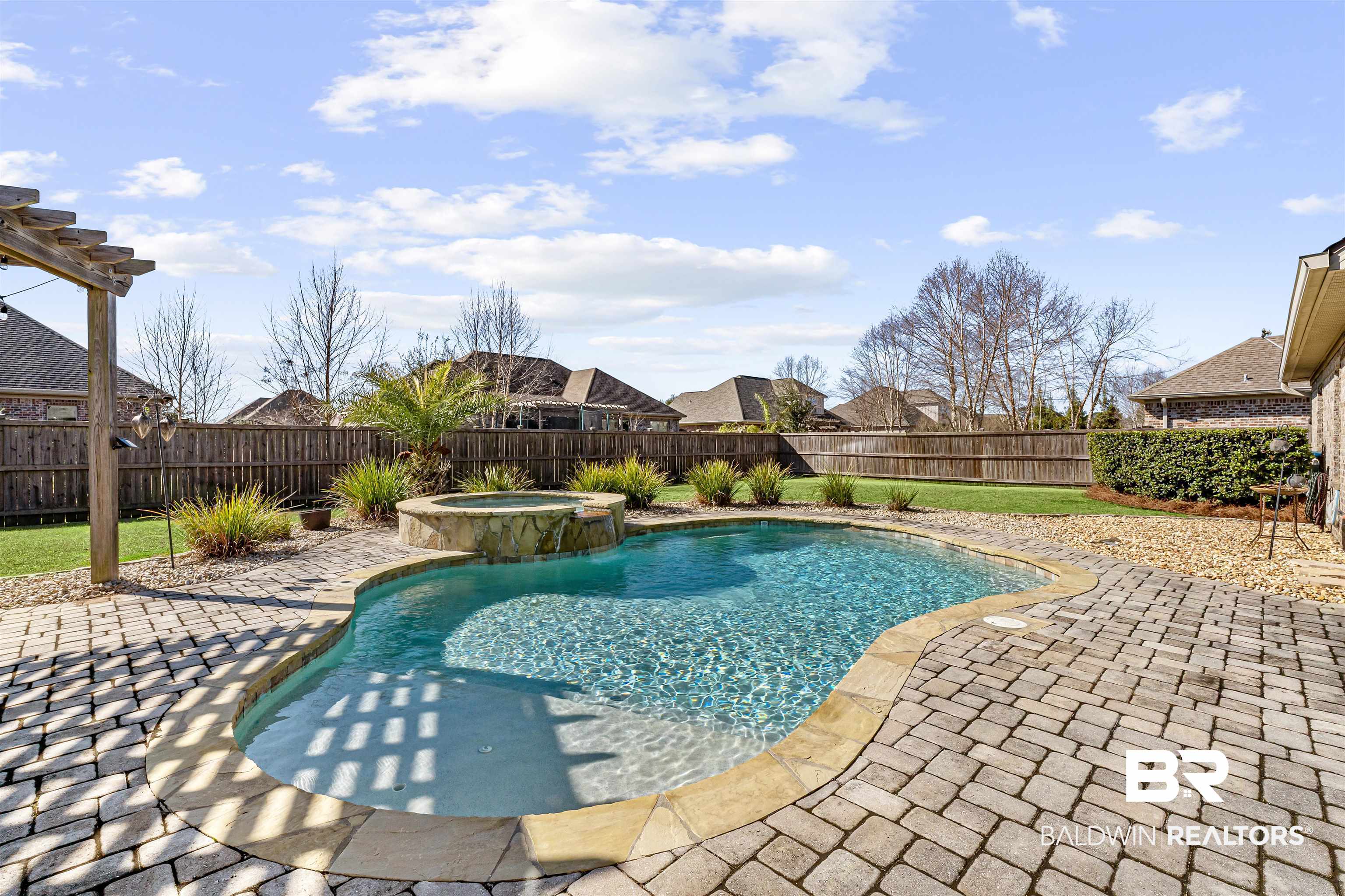 8844 Rosedown Lane Daphne, AL 36526 - Photo 23 of 24 Relaxing pool / spa with a patio area, a fenced backyard, and a pergola