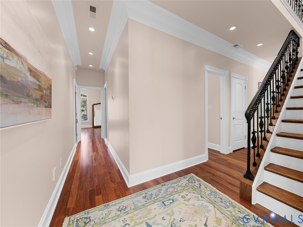 13612 Waterswatch Court Midlothian, VA 23113 - Photo 63 of 88 a view of a hallway with wooden floor and staircase